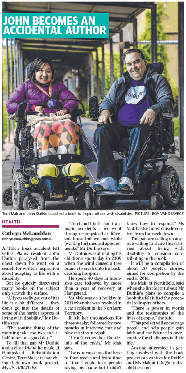 Terri and John in wheelchairs. Terri is to the left and wearing a purple top, and bright yellow shoes. John has a purple dignity shirt on, and they are sitting under cover on a concrete path